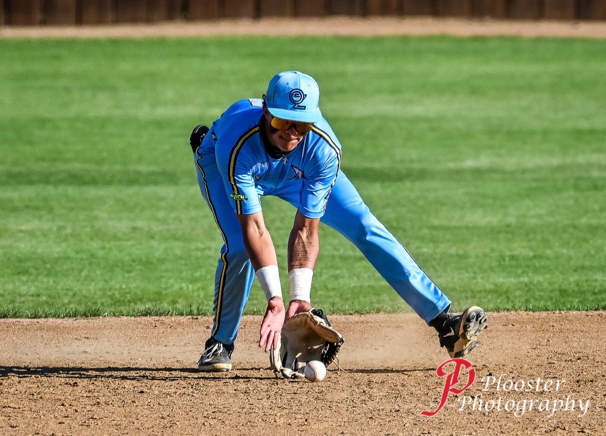 Cy Taylor charging a ground ball in the infield