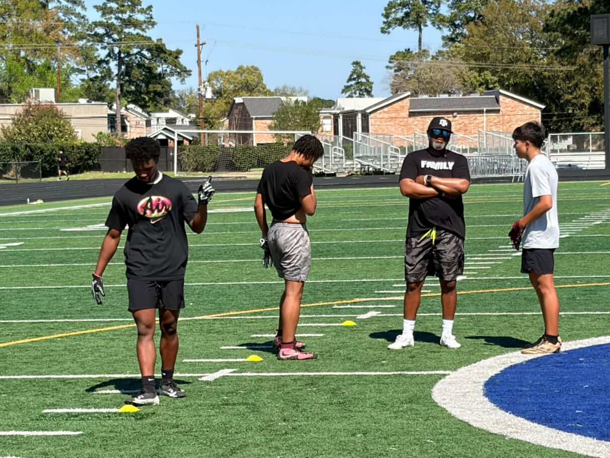 Coach Chris Taylor leading a football training session Coach Chris Taylor leading a Taylor Sports Performance football training session with athletes on the field