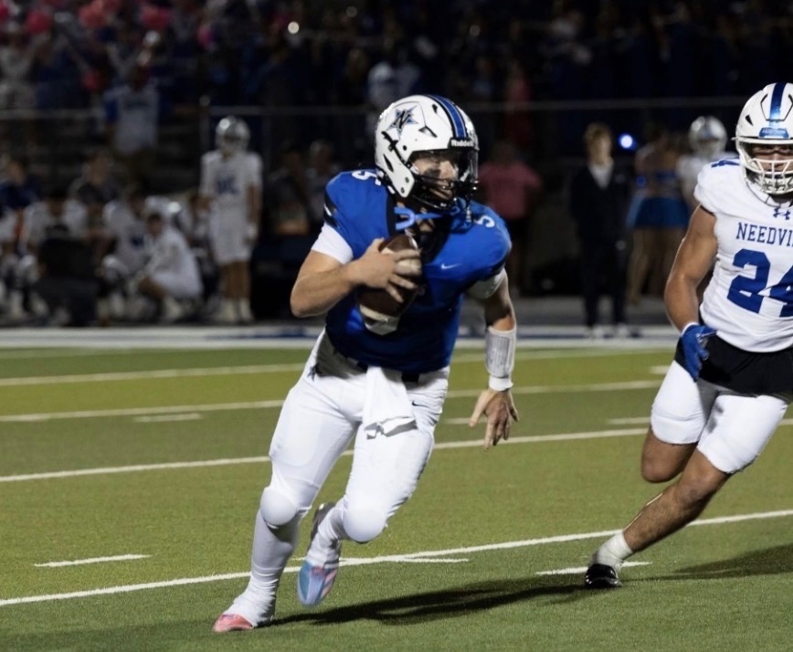 Jace Jablonski Class of 2027 quarterback at Navasota High School in Navasota Texas scrambling out of the pocket