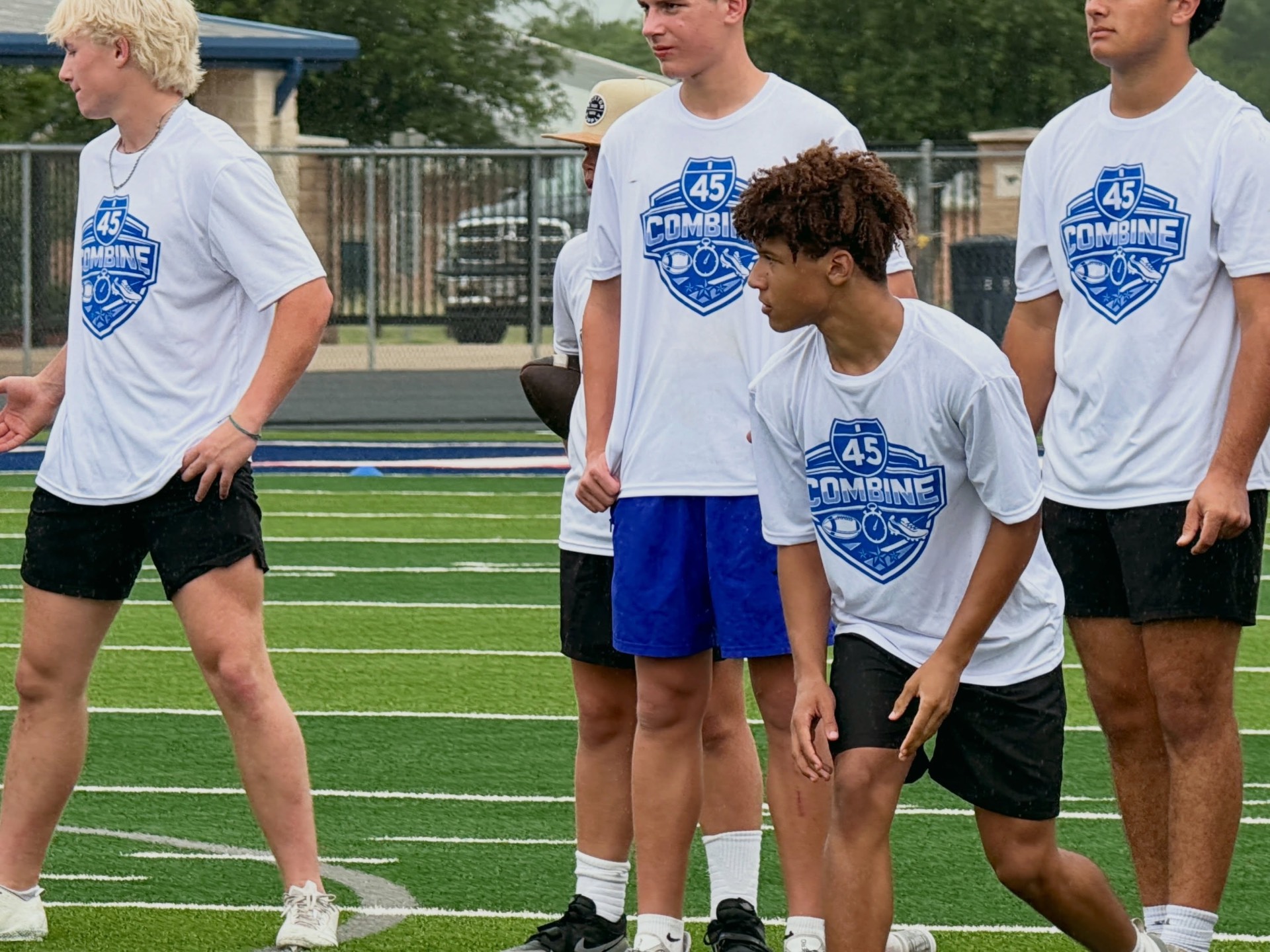 High school athletes lined up for speed and agility training drills at a Taylor Sports Performance football combine camp in East Texas
