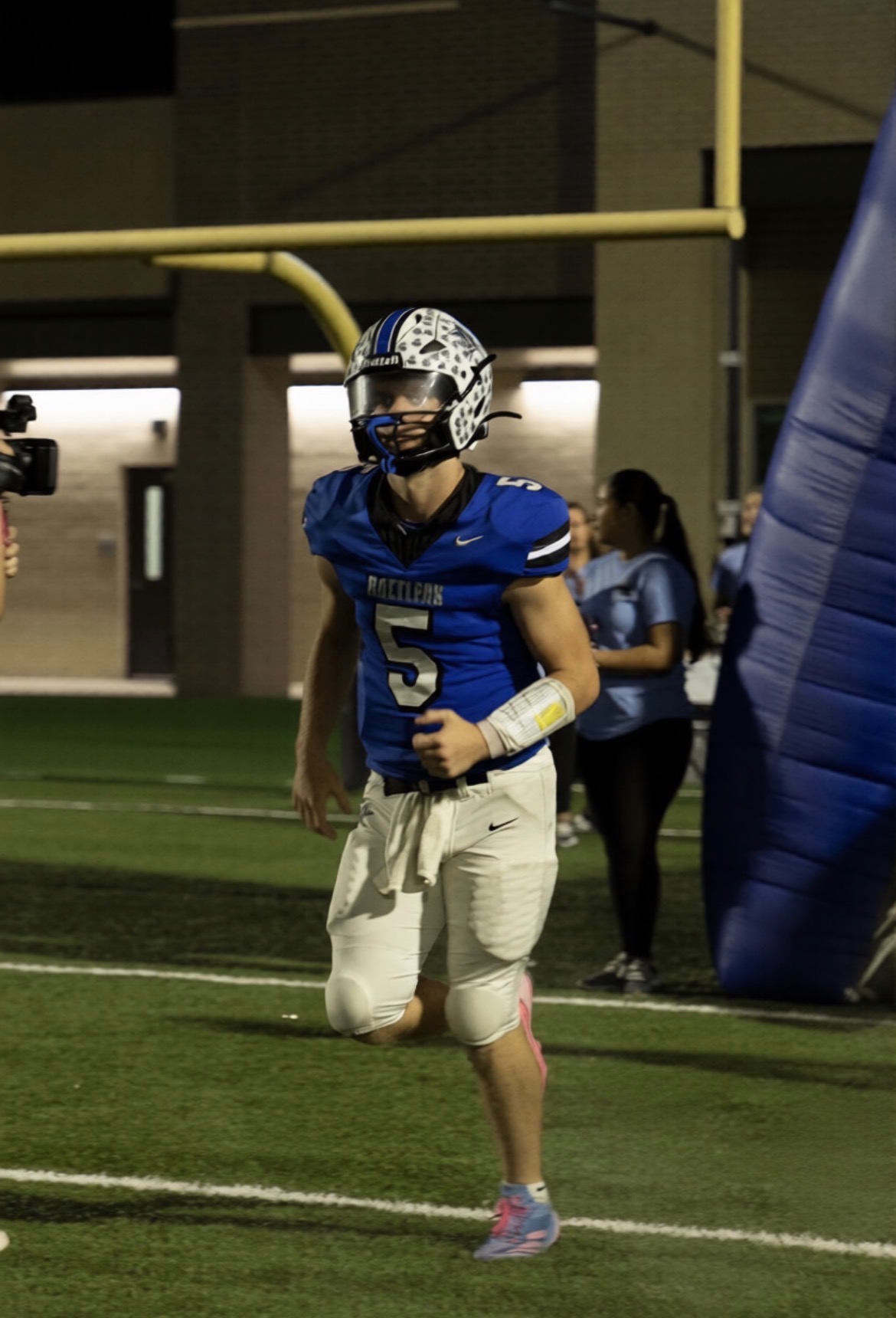 Jace Jablonski taking the field before a Friday night game at Navasota High School