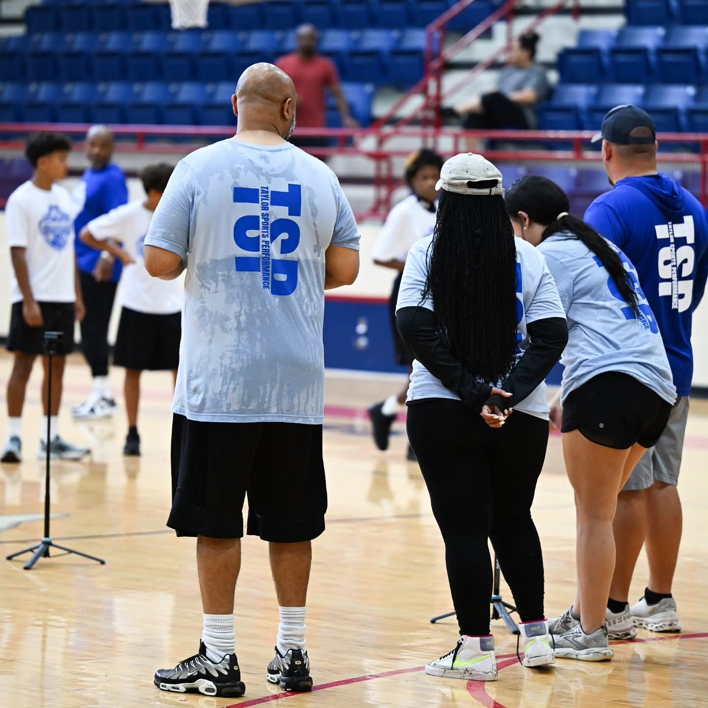 Meet the Taylor Sports Performance coaching staff — TSP coaches mentoring student-athletes during a football training and athlete development session in East Texas